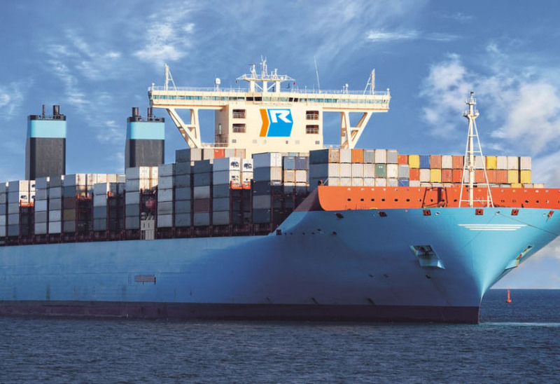 A huge container ship in the sea.